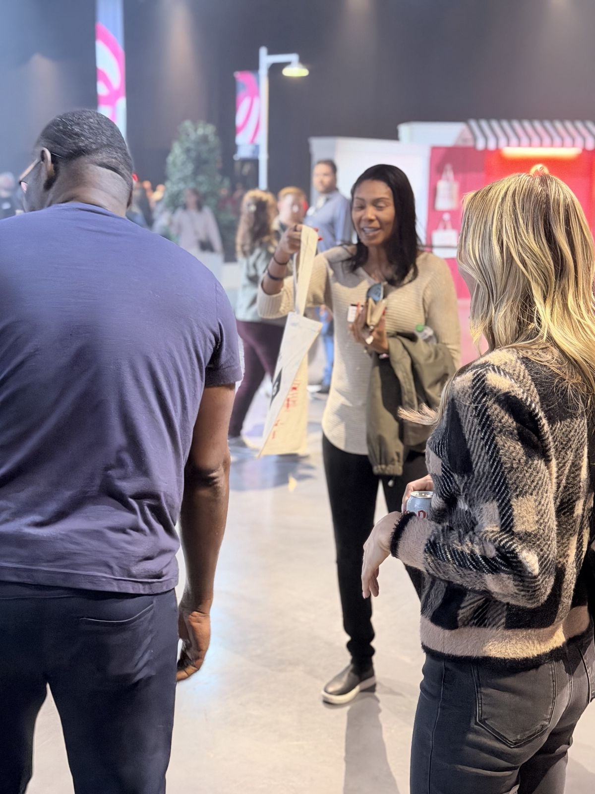 Guests watching custom merch get printed live at a Detroit event